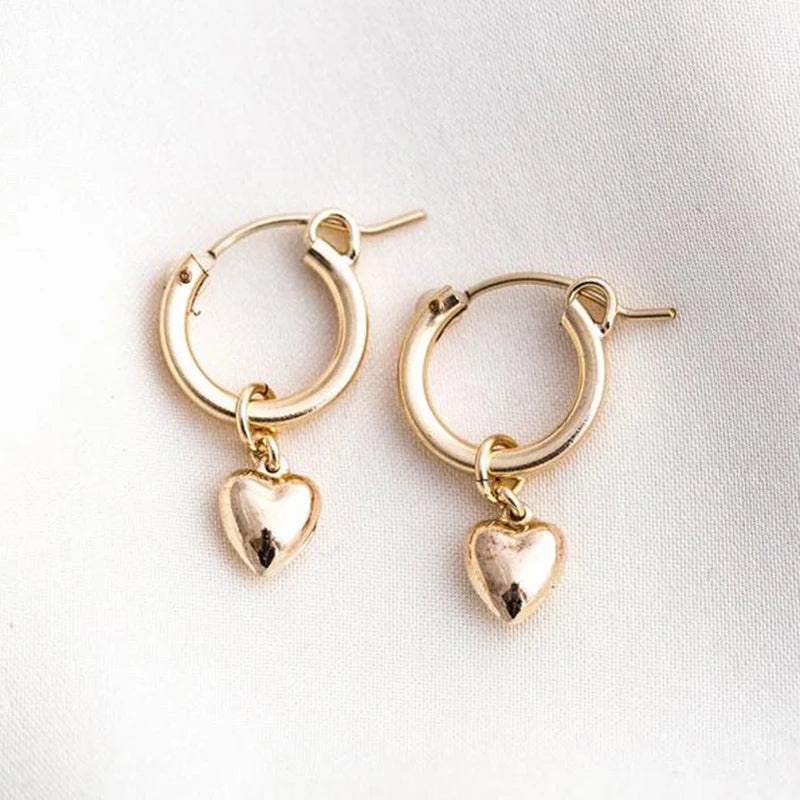 Heart EarringsSPECIFICATIONS
Metals Type: Gold filled
Item Weight: 1.2g
Earring Type: hoop earrings
Shape\pattern: Round
Type:: Dangle Earrings for Women
Color:: GoldChic ForeverHeart Earrings