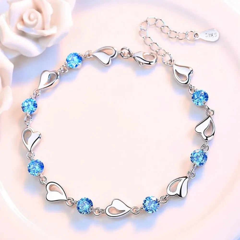 Bela BraceletSPECIFICATIONS
Metal Stamp: 925,Sterling
Metals Type: silver
Main Stone: Zircon
Item Weight: 6g
Side Stone: CRYSTAL
Shape\pattern: HEARTChic ForeverBela Bracelet