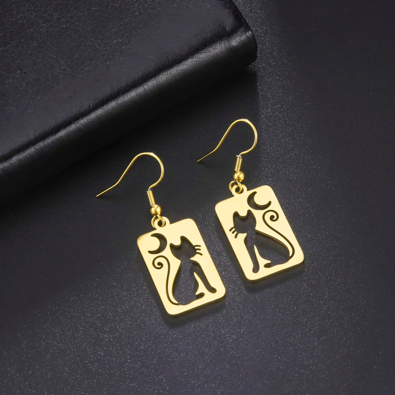 Cat EarringSPECIFICATIONS
Material: Metal
Metals Type: STAINLESS STEEL
Earring Type: drop earrings
Shape\pattern: Animal
Color: Gold Color/Steel Color
Quantity: 1pcs
Feature: NChic ForeverCat Earring