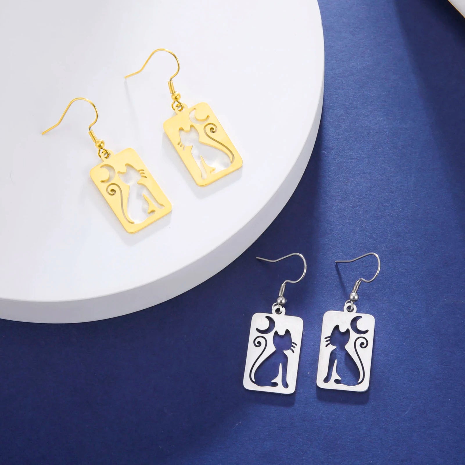 Cat EarringSPECIFICATIONS
Material: Metal
Metals Type: STAINLESS STEEL
Earring Type: drop earrings
Shape\pattern: Animal
Color: Gold Color/Steel Color
Quantity: 1pcs
Feature: NChic ForeverCat Earring