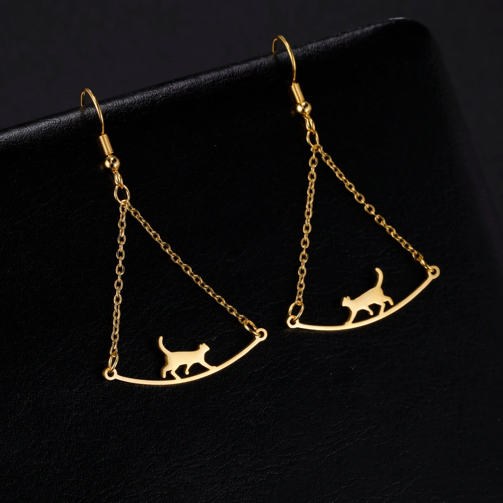 Cat EarringSPECIFICATIONS
Material: Metal
Metals Type: STAINLESS STEEL
Earring Type: drop earrings
Shape\pattern: Animal
Color: Gold Color/Steel Color
Quantity: 1pcs
Feature: NChic ForeverCat Earring