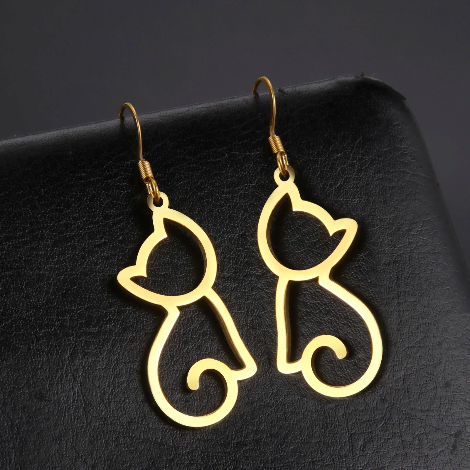 Cat EarringSPECIFICATIONS
Material: Metal
Metals Type: STAINLESS STEEL
Earring Type: drop earrings
Shape\pattern: Animal
Color: Gold Color/Steel Color
Quantity: 1pcs
Feature: NChic ForeverCat Earring