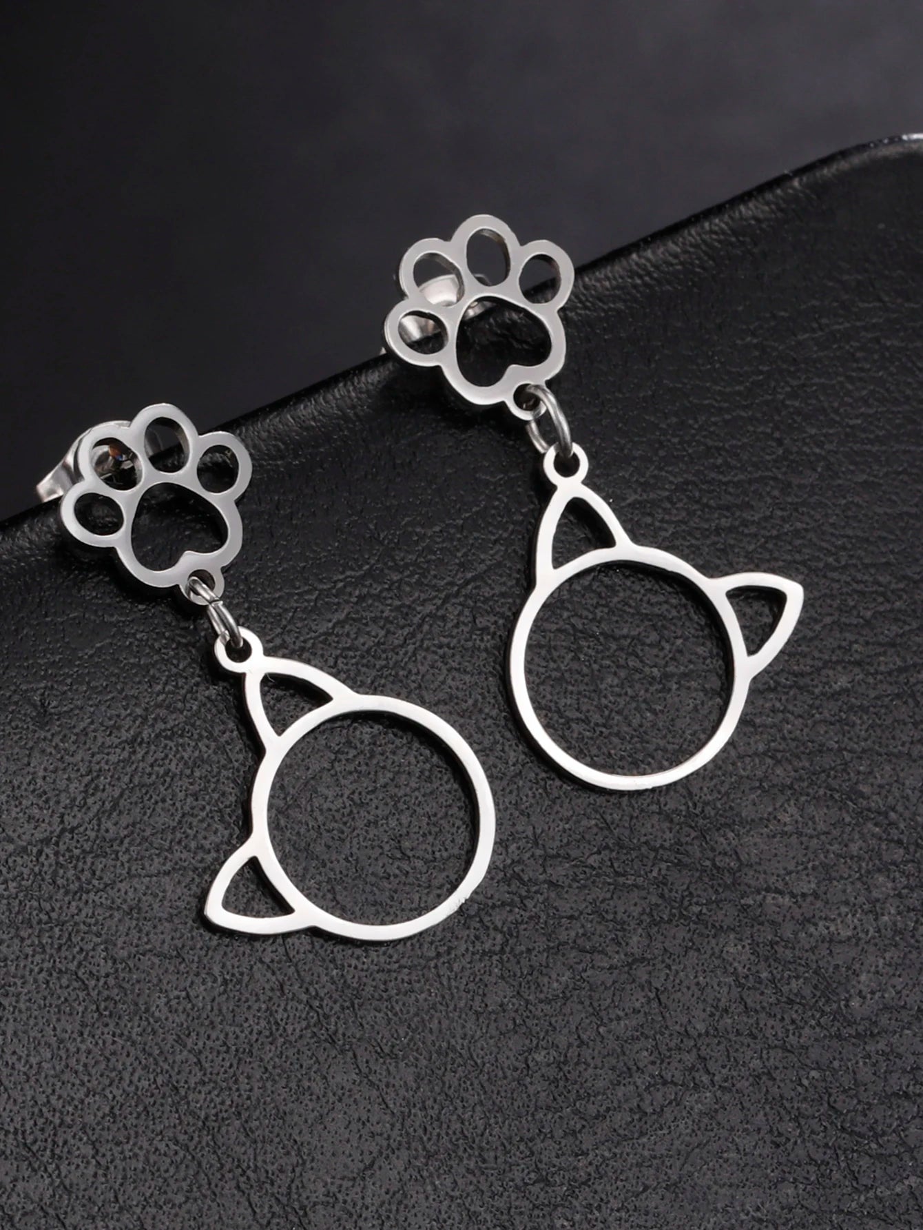 Cat EarringSPECIFICATIONS
Material: Metal
Metals Type: STAINLESS STEEL
Earring Type: drop earrings
Shape\pattern: Animal
Color: Gold Color/Steel Color
Quantity: 1pcs
Feature: NChic ForeverCat Earring