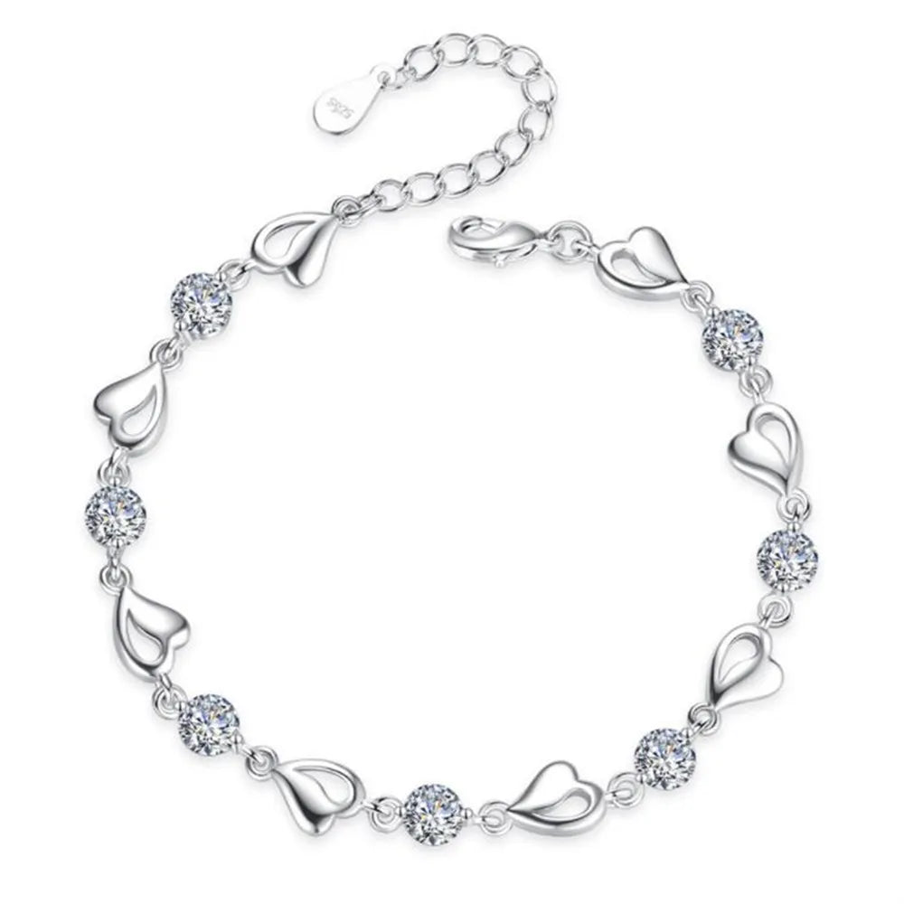 Bela BraceletSPECIFICATIONS
Metal Stamp: 925,Sterling
Metals Type: silver
Main Stone: Zircon
Item Weight: 6g
Side Stone: CRYSTAL
Shape\pattern: HEARTChic ForeverBela Bracelet